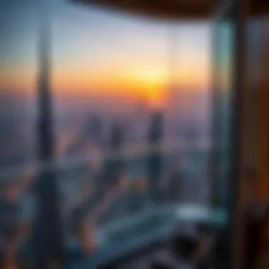 View from a balcony in Burj Khalifa overlooking the Dubai skyline at sunset